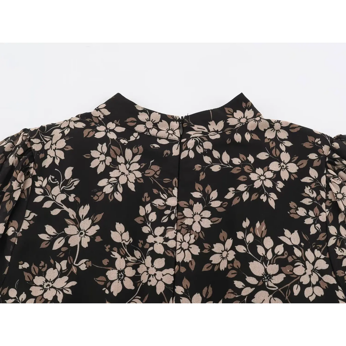 Close-up of stand collar and shoulder with black back zipper on floral print dress