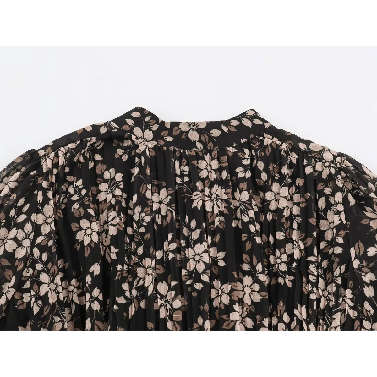 Close-up of stand collar and gathered puff sleeve on black floral print maxi dress