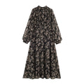 Full front view of black floral print puff sleeve maxi dress with stand collar, gathered bodice and flared skirt on white background