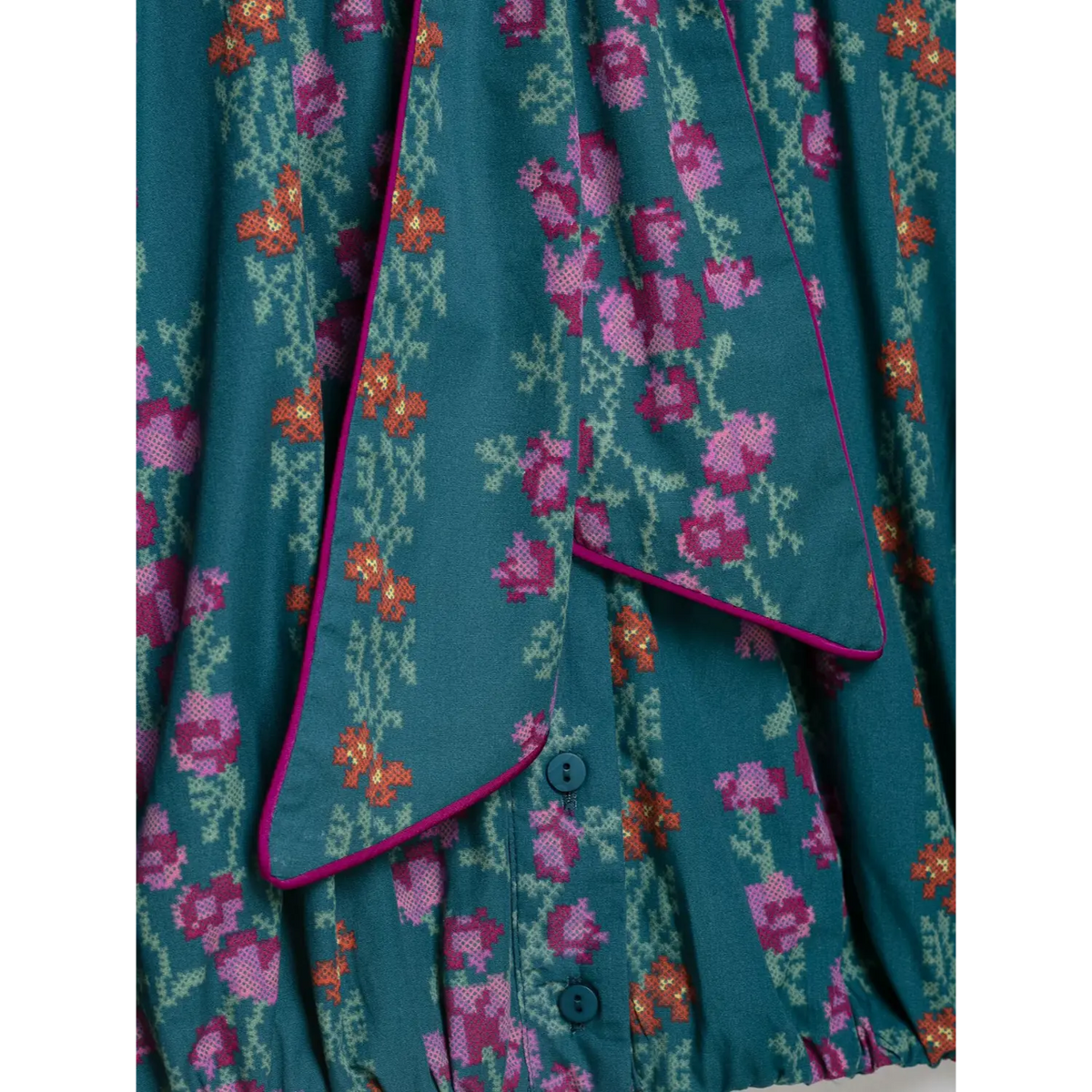Close-up of tie ends and front buttons