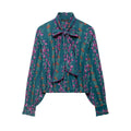 Front flat lay of floral print tie neck ruffle blouse
