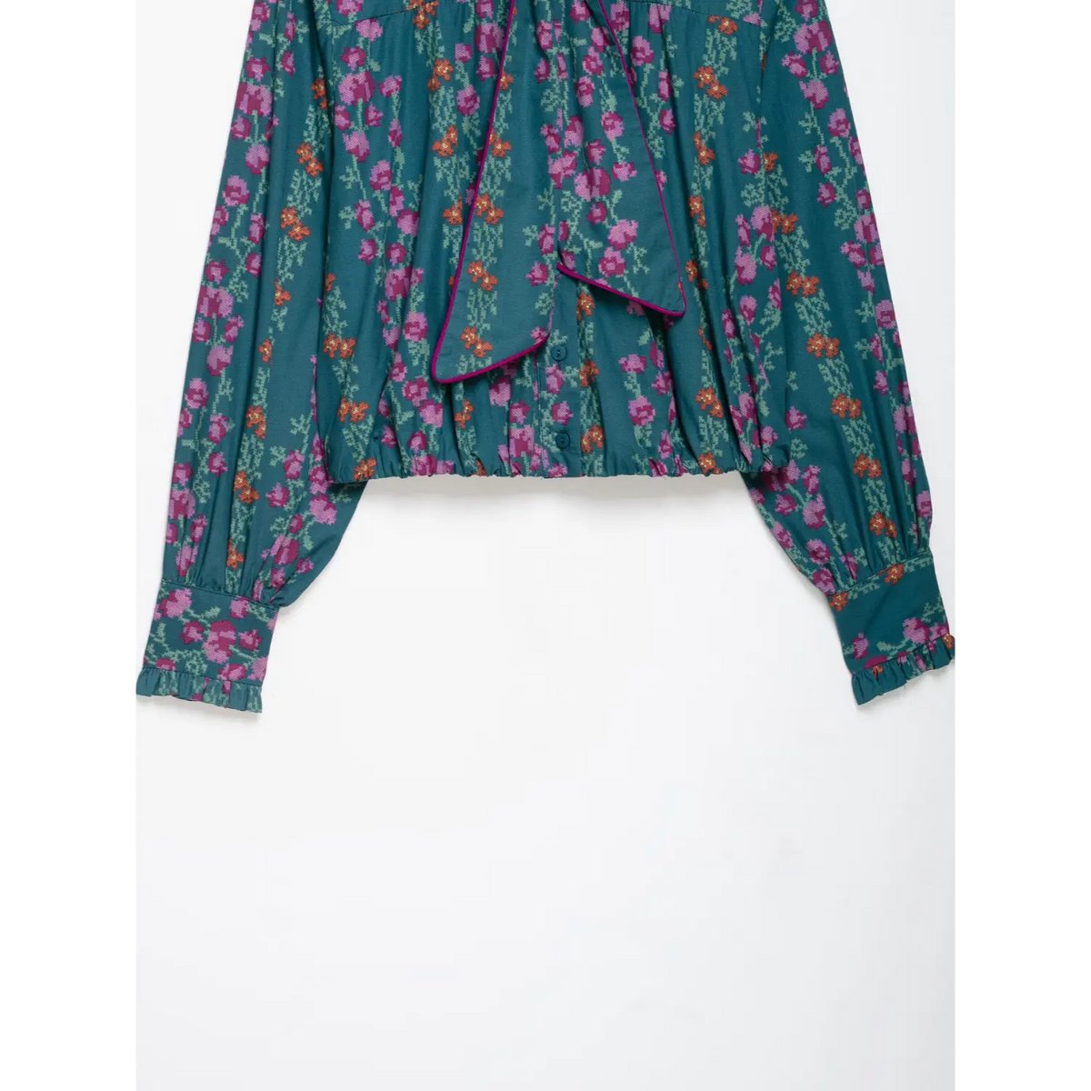 Close-up of shirred hem and tie bow