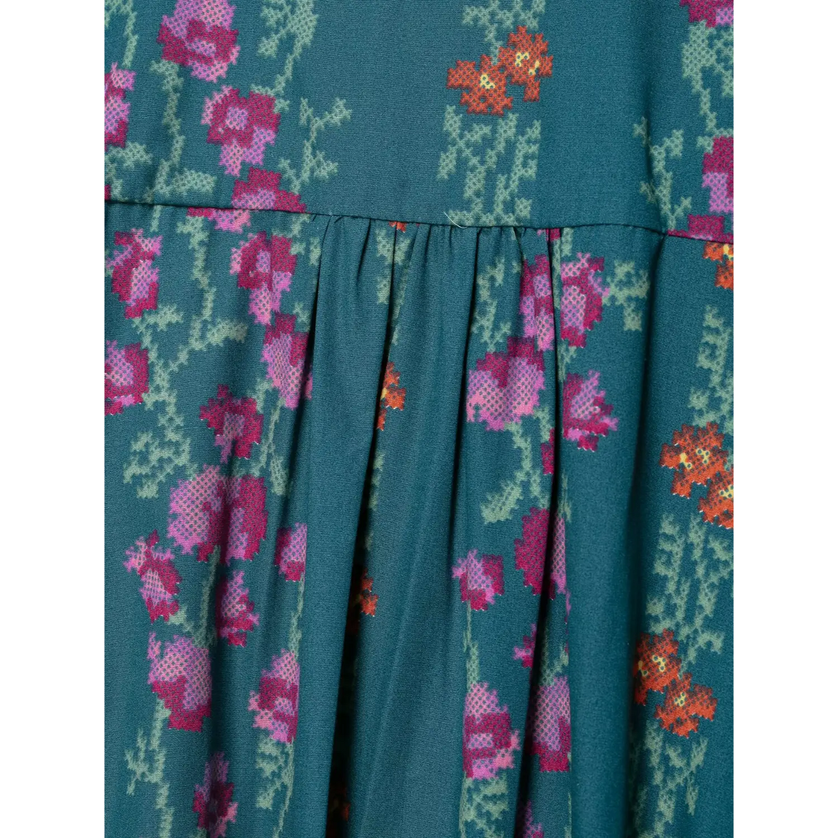 Close-up of floral print and pleated detail
