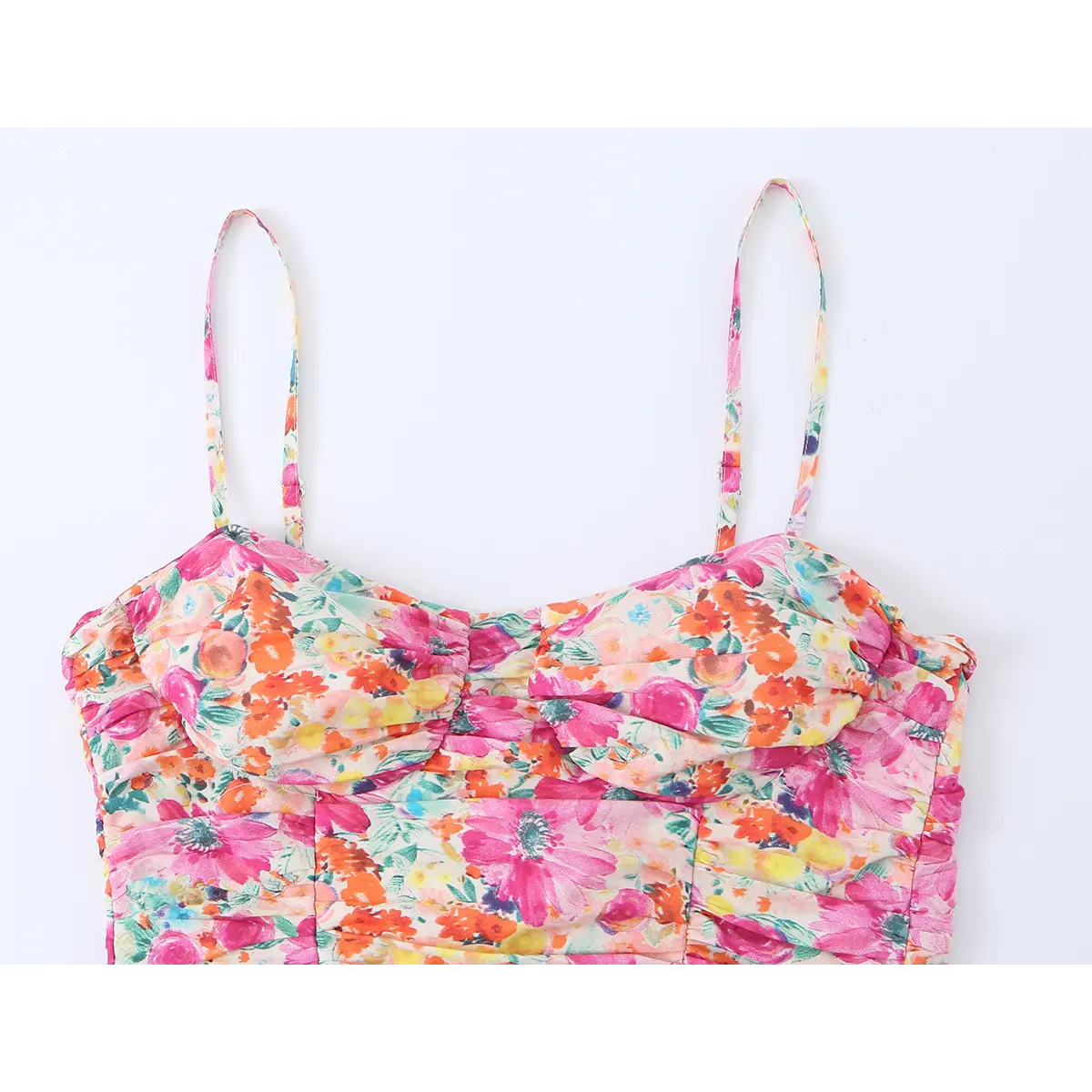 Close-up of the dress's sweetheart neckline and spaghetti straps, showing the bust ruching.