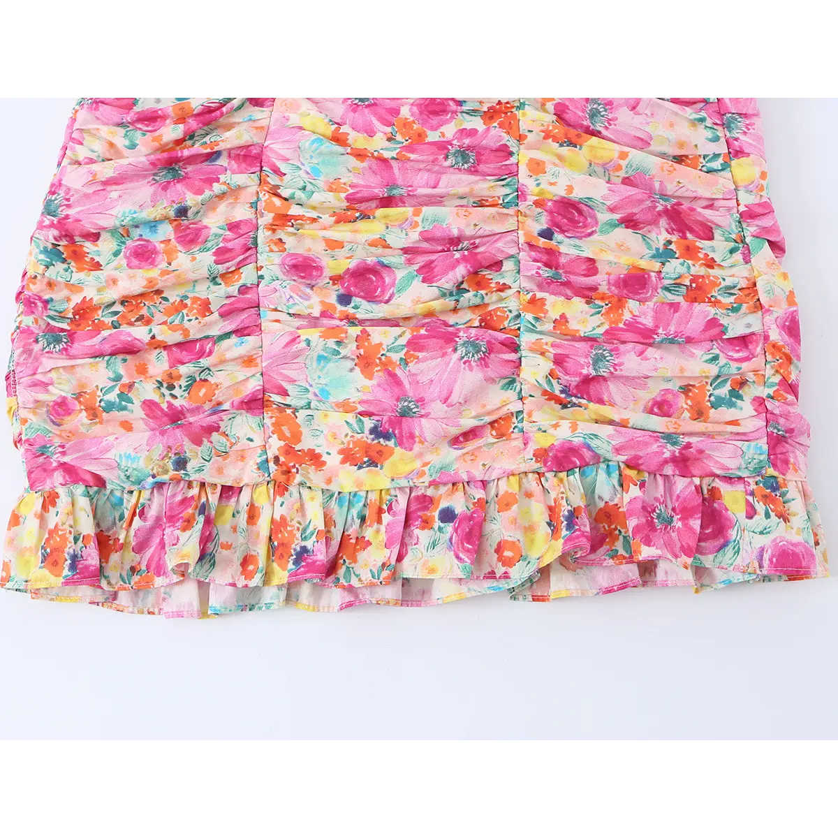 Full shot of the dress's skirt, showing the ruched texture and ruffled hem with the floral print.