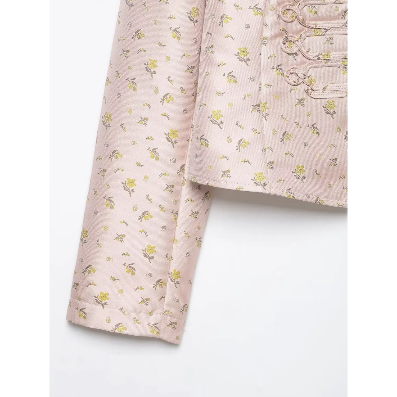 Long sleeve cuff close-up, pink floral satin military cropped jacket fabric texture