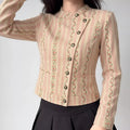 Model wearing pink floral striped stand collar cropped jacket, asymmetrical metal button front view outfit