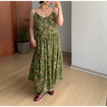 Straight full front indoor mirror shot of dark green micro pink floral tier maxi slip dress, loose flowy A-line layered skirt, matching burgundy leather mary jane flats