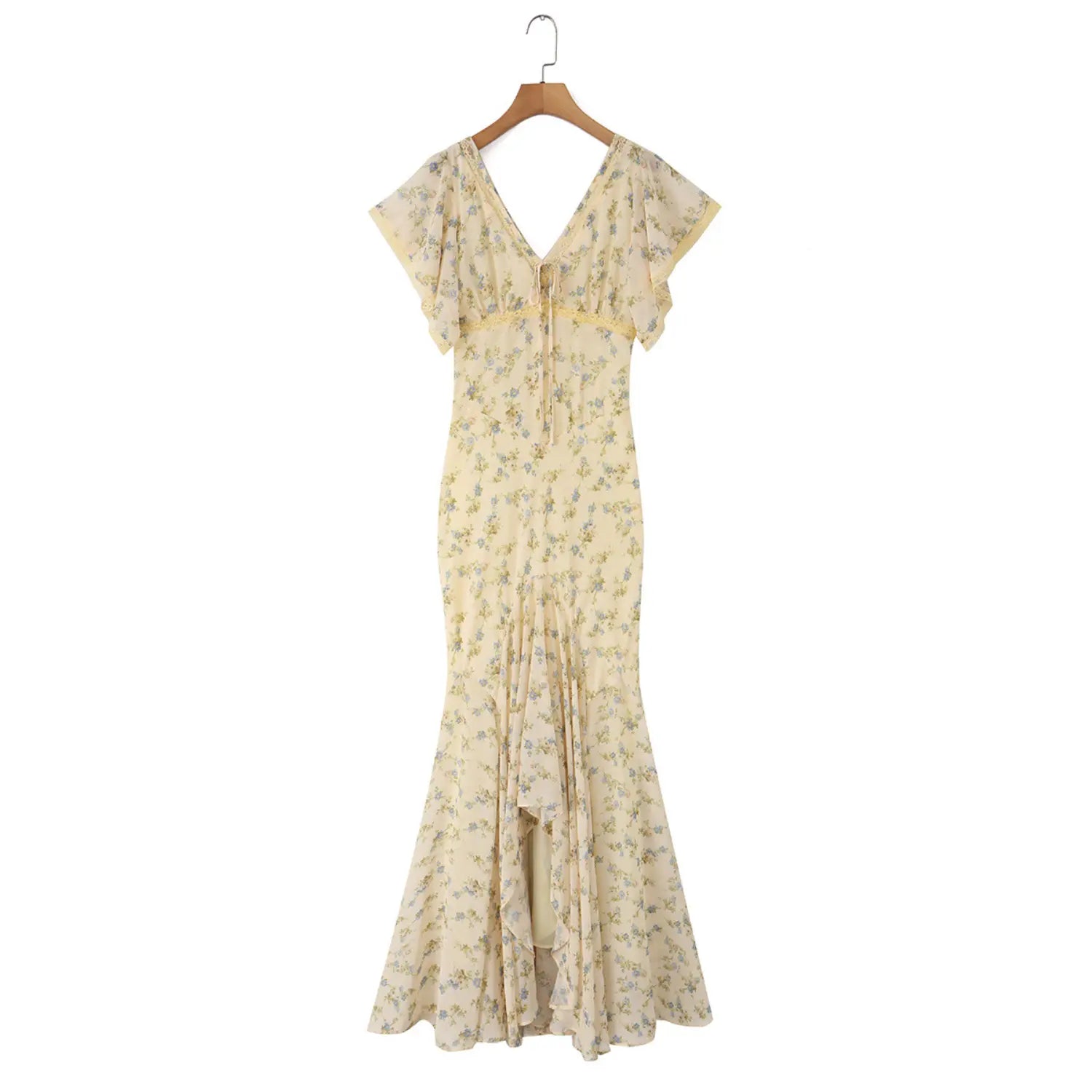 Full front hanging shot on wooden hanger of cream floral chiffon mermaid maxi dress, fitted waist layered ruffled skirt for spring outdoor travel