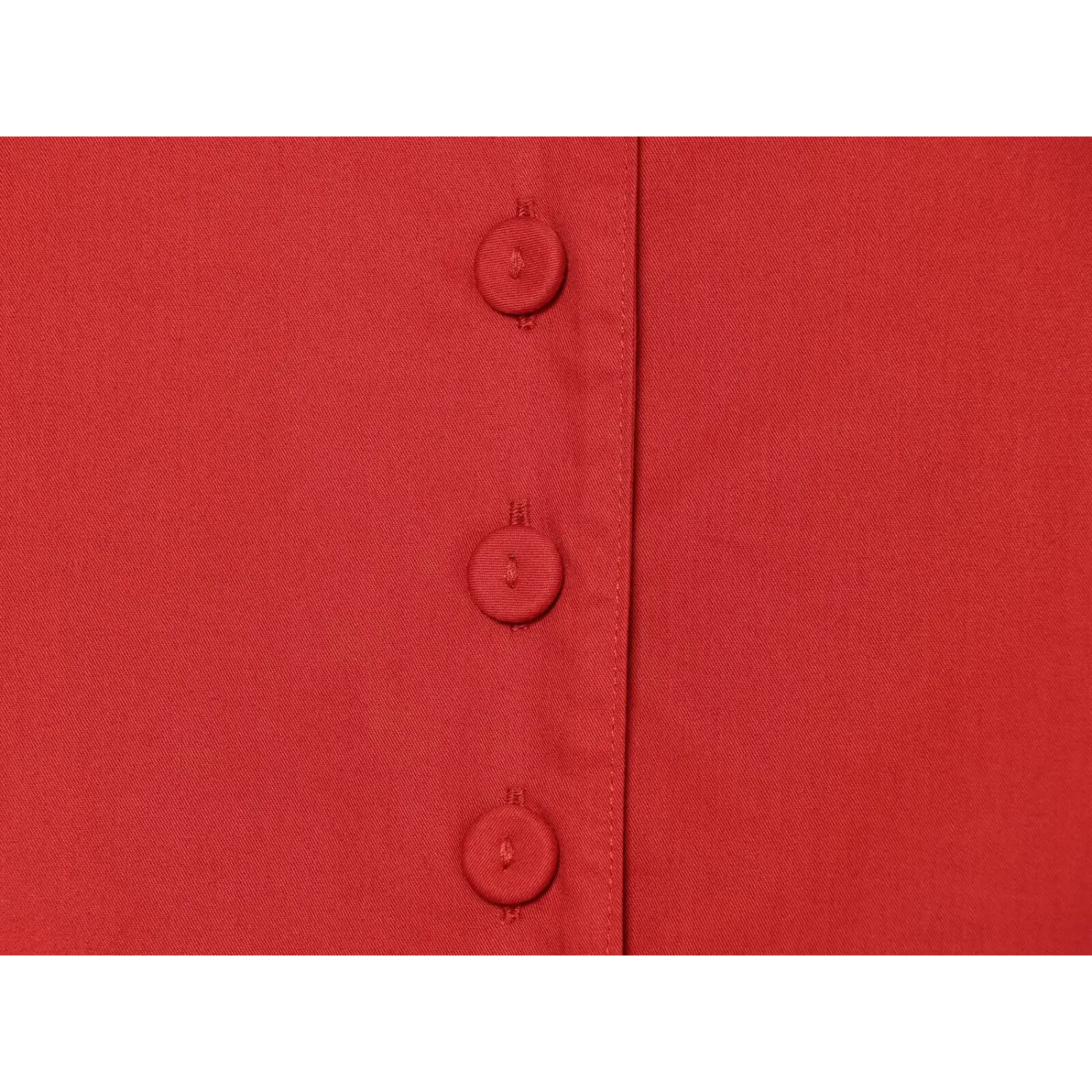 Front matching fabric covered button macro close-up, thick wrapped buttons tight stitching evenly spaced placket clean solid button detail shot