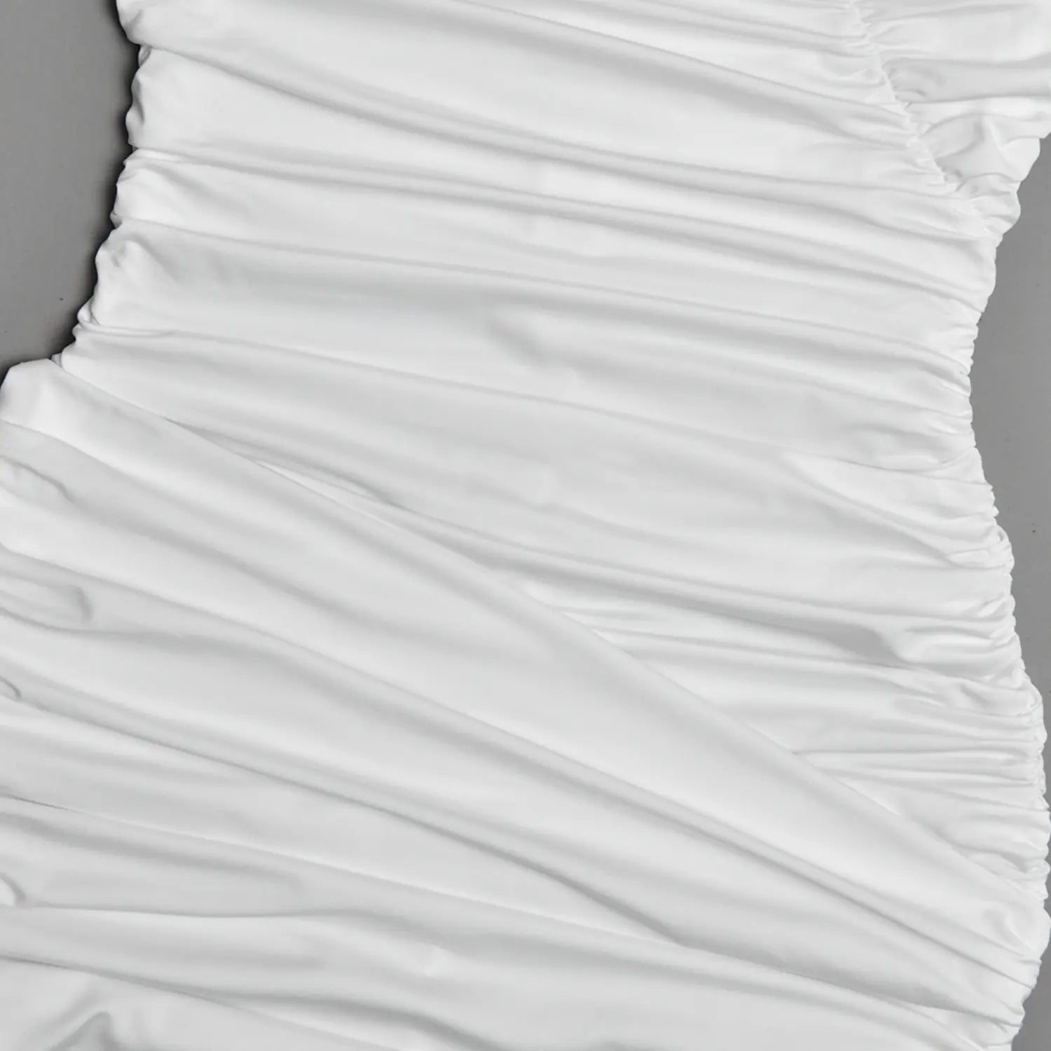 Diagonal wrinkle ruched waist fabric detail of white tight mini bodycon dress