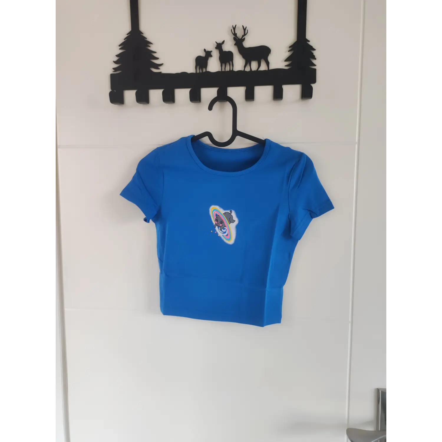 Front hanging shot bright blue cute cat planet graphic fitted crop t-shirt on hanger