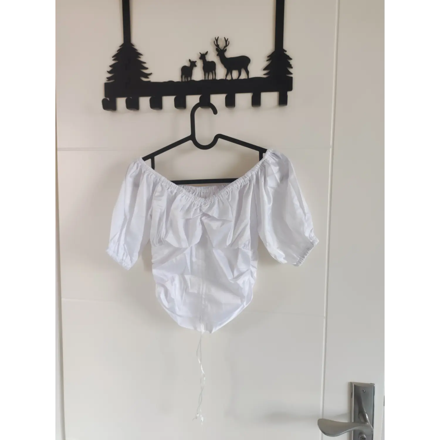Front hanging display white off shoulder puff sleeve ruched drawstring crop top on hanger