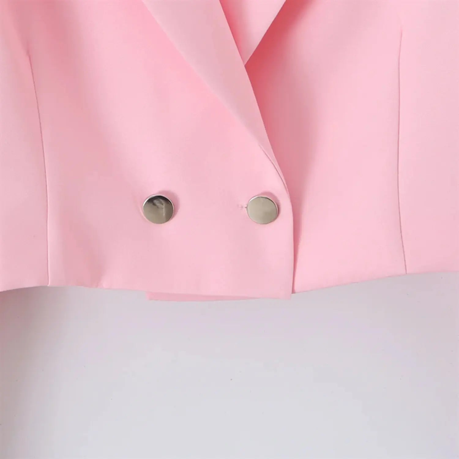 Double-breasted front placket macro shot, round silver metal buttons, reinforced buttonholes, clean folded edge