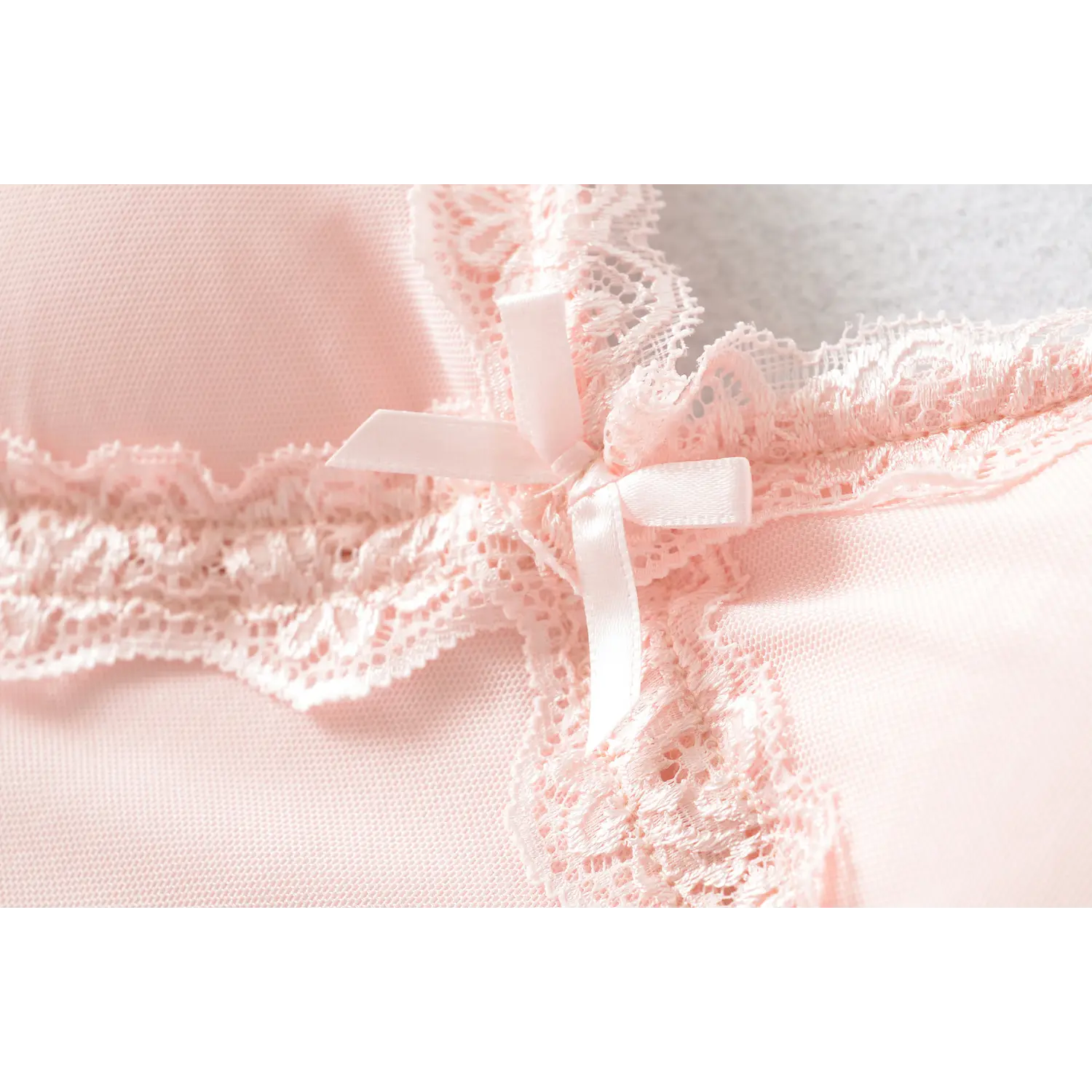 Extreme close-up of chest decoration, small satin bow knot, double-layer hollow lace crisscross stitching, delicate lace carving texture