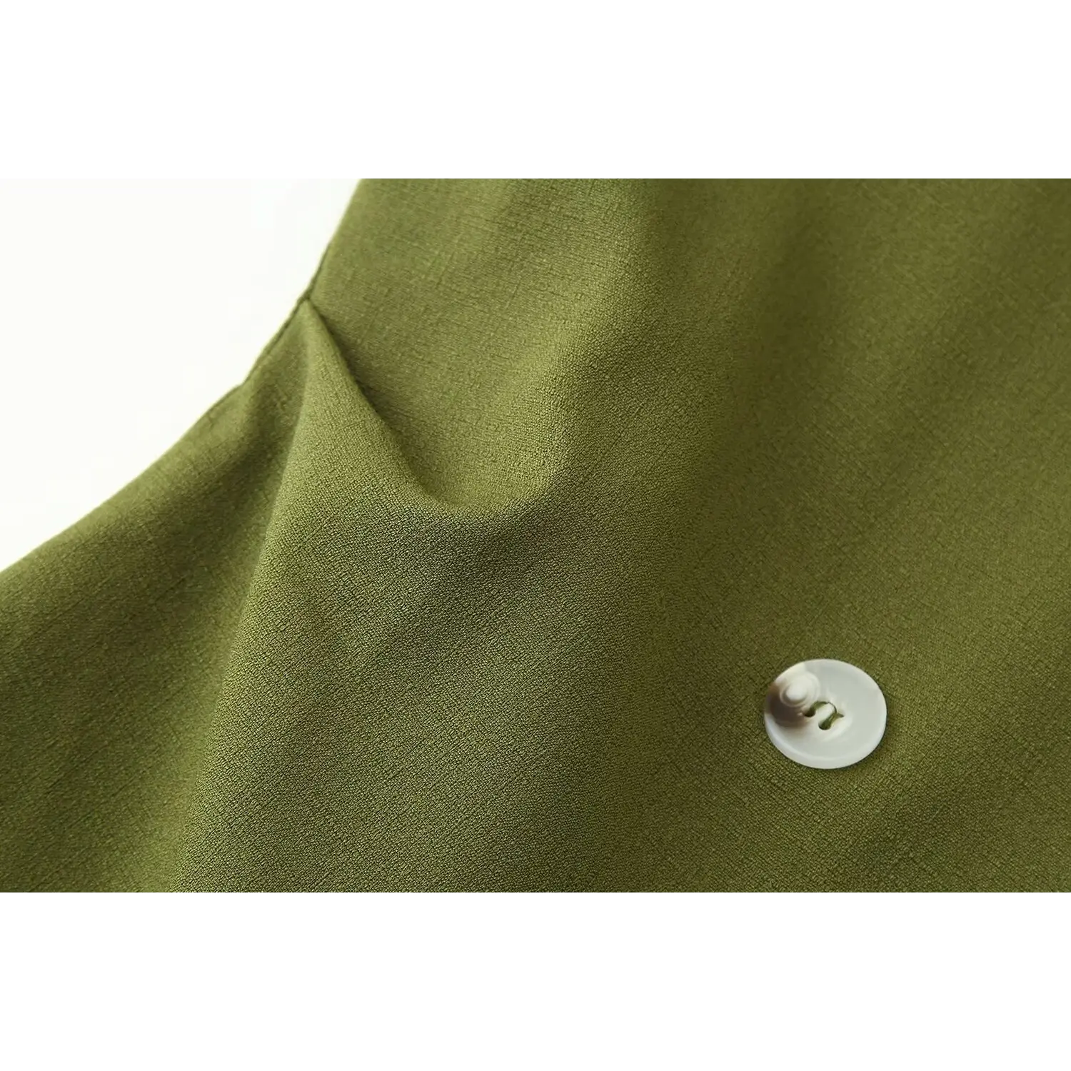 Button placket close-up, off-white round two-hole shell button, woven olive suit fabric