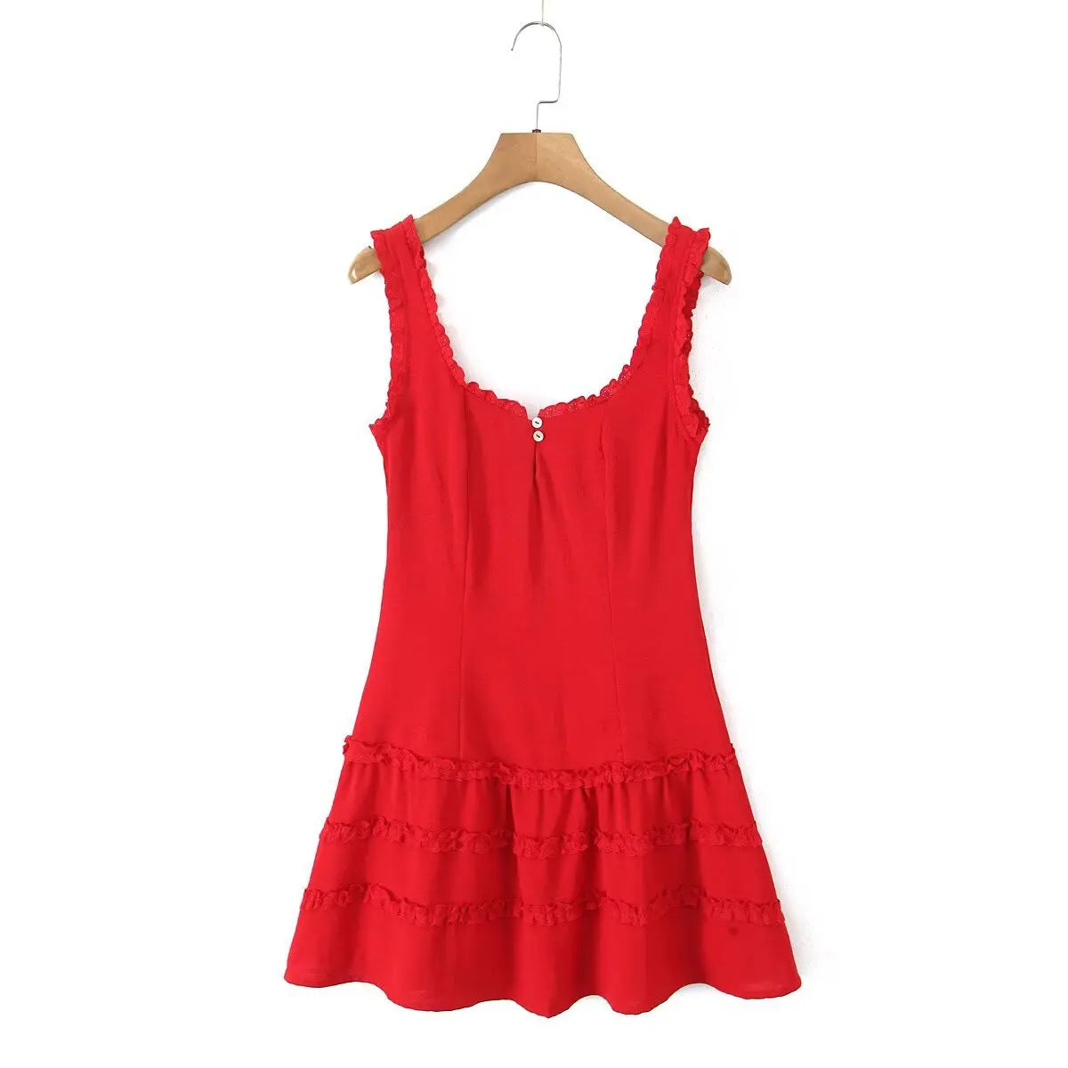  Front view of a red lace-trimmed cami dress on a wooden hanger, showcasing the shell buttons and tiered lace skirt.