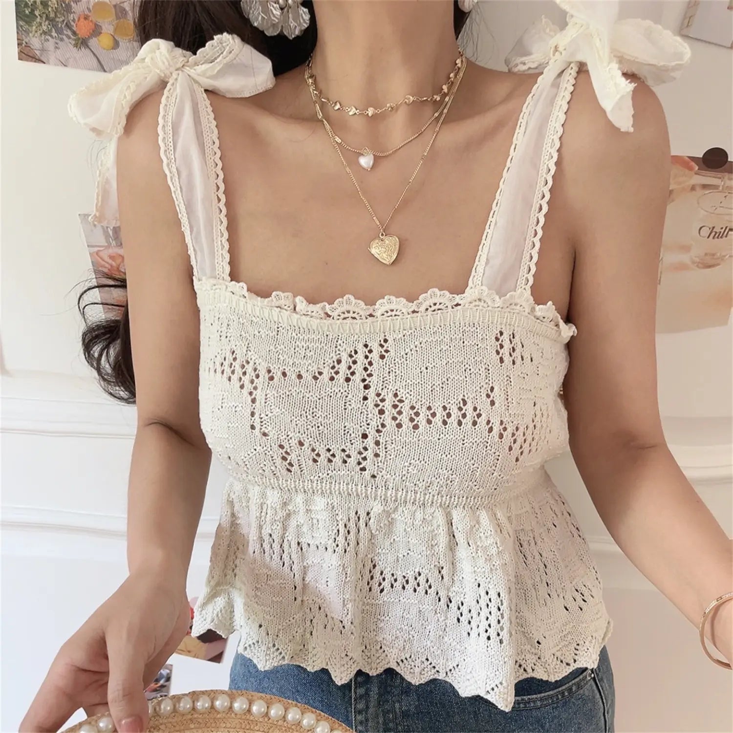 Three quarter shot highlighting gathered peplum waist and wavy scalloped bottom hem