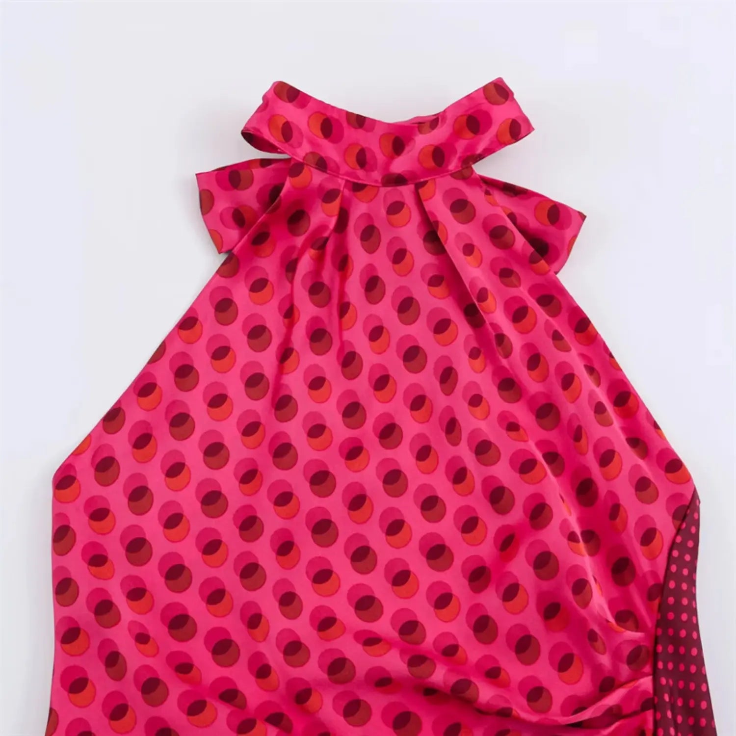 Front halter neck partial shot, stand halter collar, bust side ruched shaping, glossy satin polka dot texture