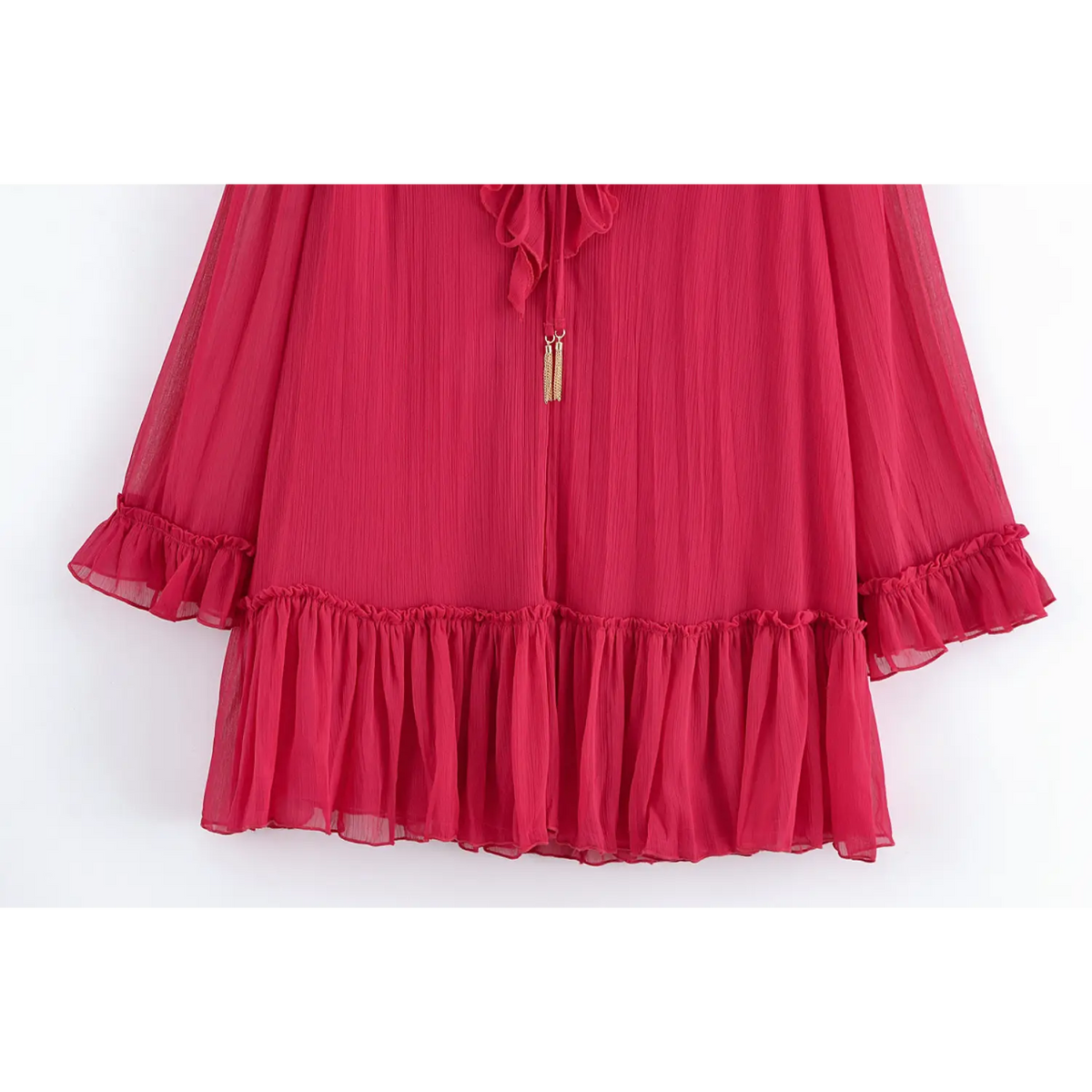 Close-up of gold tassel tie and ruffle tiered skirt