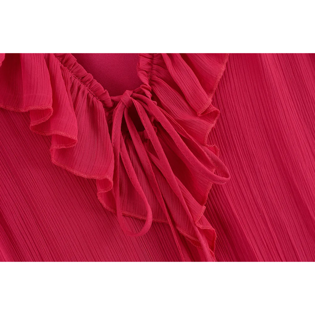 Close-up of tie neck and ruffle trim
