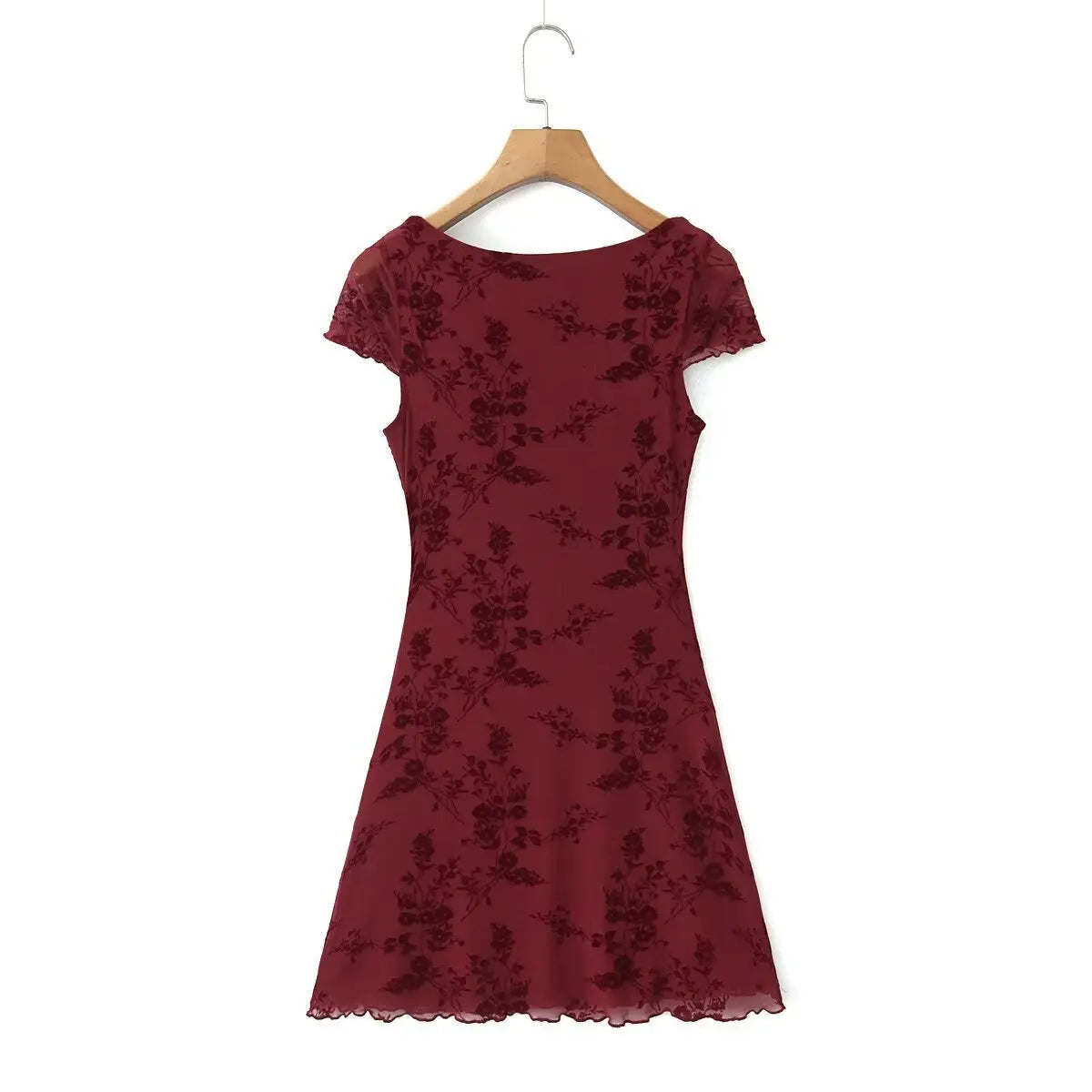 Full back view of a burgundy flocked floral mesh mini dress, showcasing the solid back and flowy hem.
