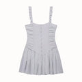 Full front view of a gray lace cami mini dress, featuring ruffled straps, ruched bodice, and gathered skirt.
