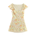Full front view of a pale yellow floral mini dress, featuring a square neckline, ruffled cap sleeves, and lace hem.