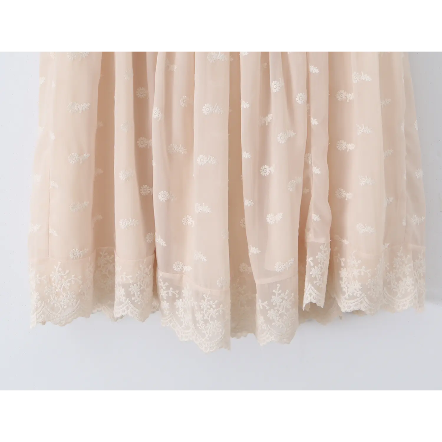 Gathered tulle swing skirt full drape flat shot, even dense shirring for fluffy A-line silhouette all-over daisy embroidery skirt shot