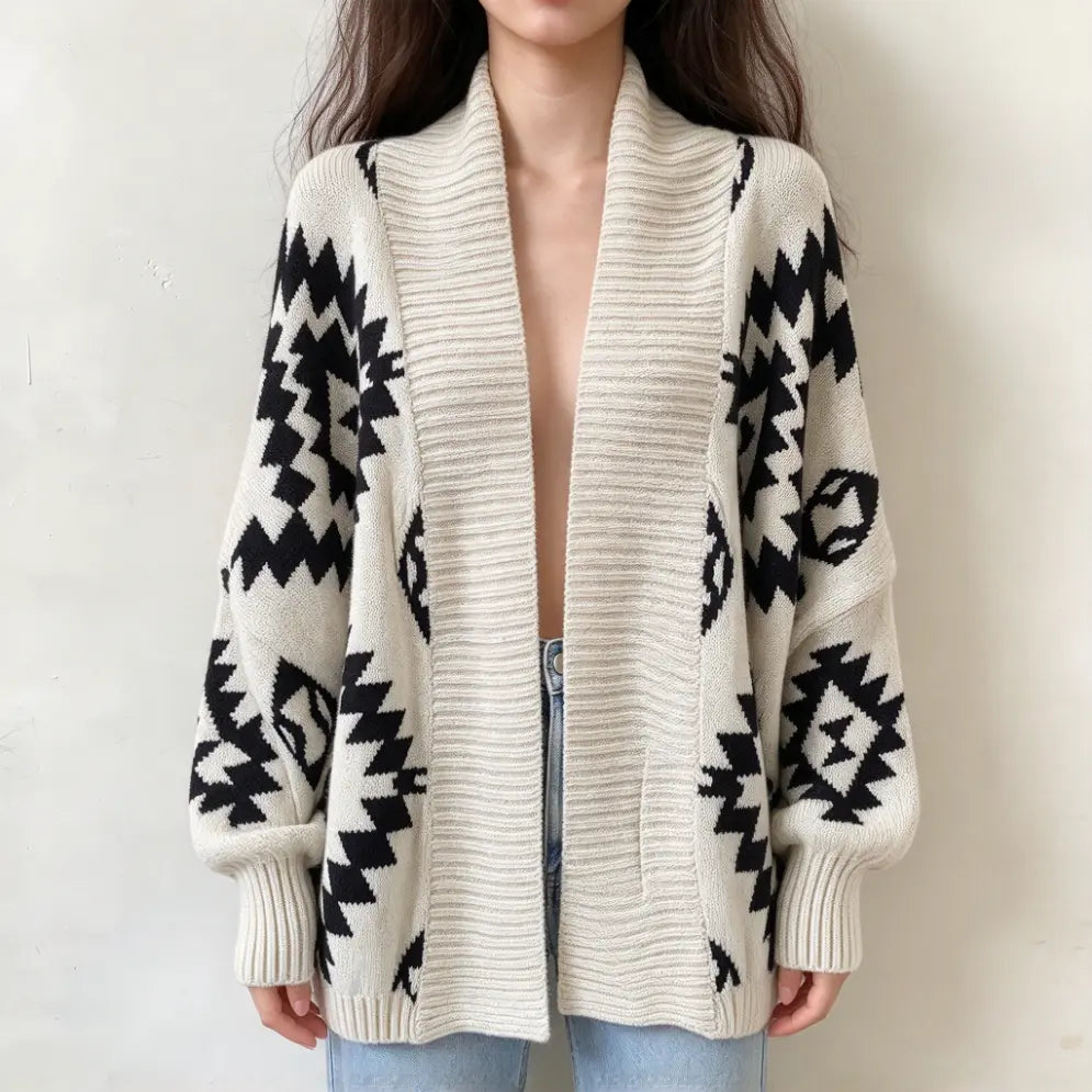 Model wearing geometric diamond intarsia open front cardigan with jeans, front view