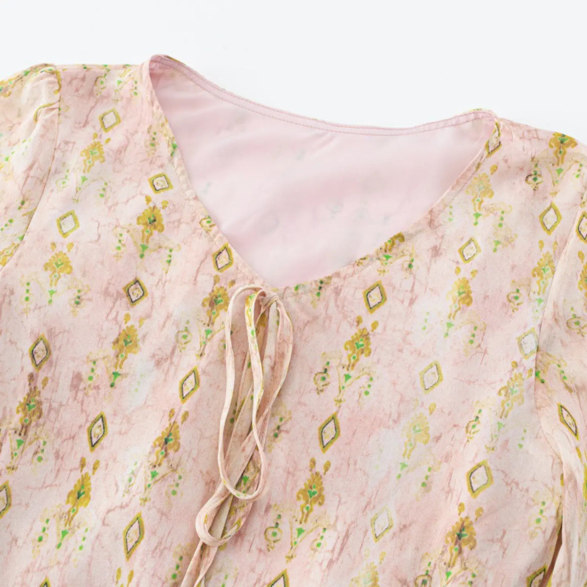 Close-up of V-neck tie detail
