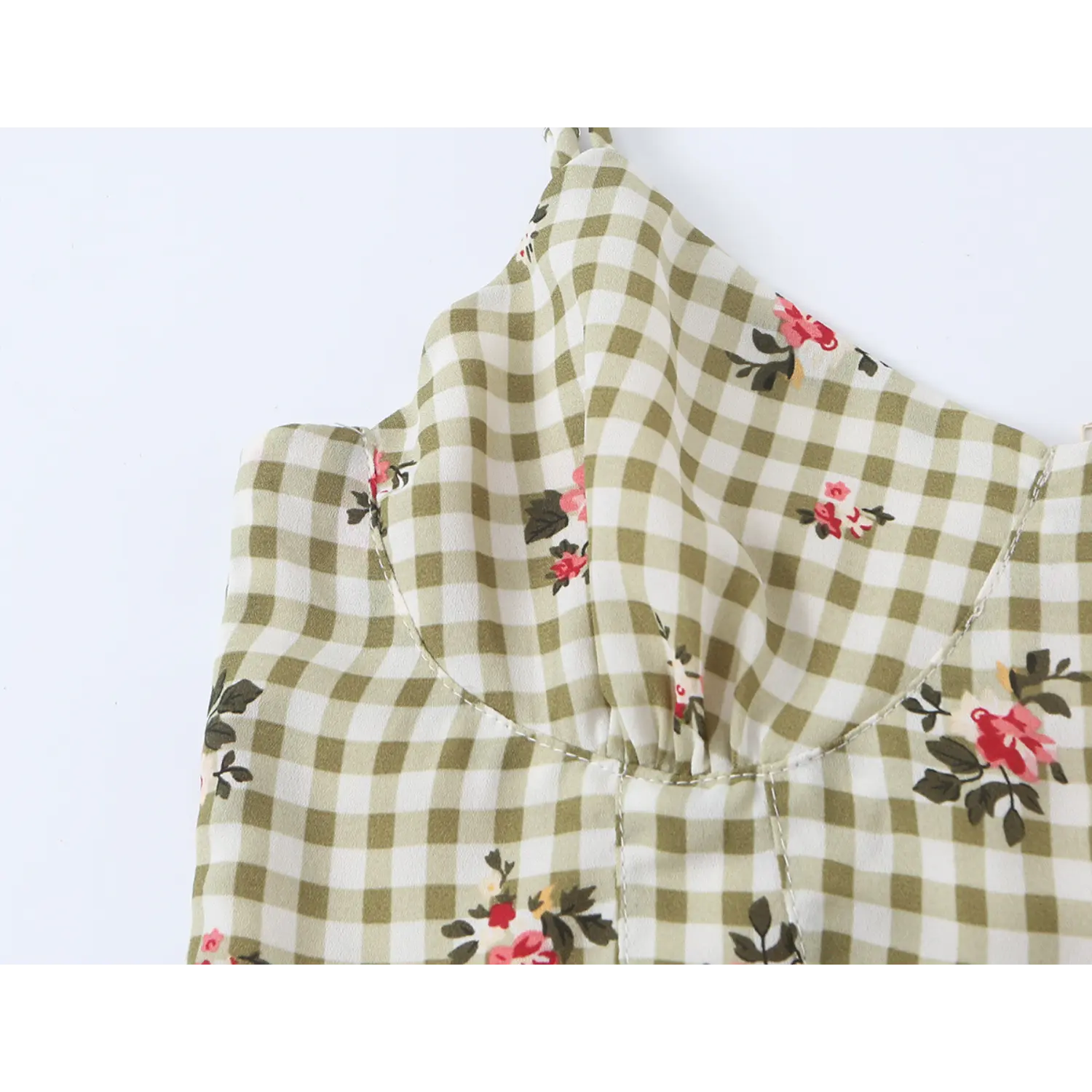 Close up sweetheart neckline detail olive gingham floral camisole, bust contour darts, small red rose print, thin adjustable spaghetti straps