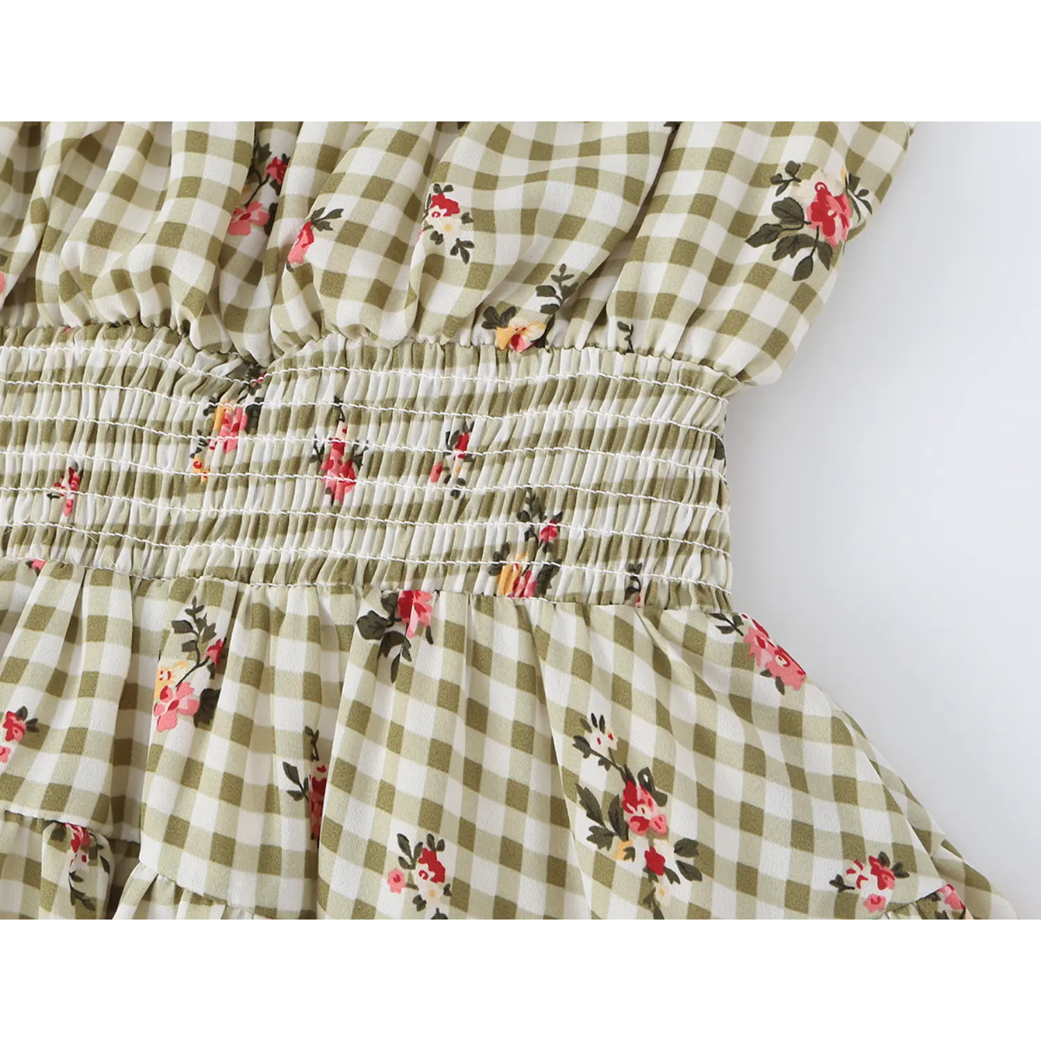close up elastic smocked waist band on olive gingham pink floral mini dress ruched waist design fabric texture