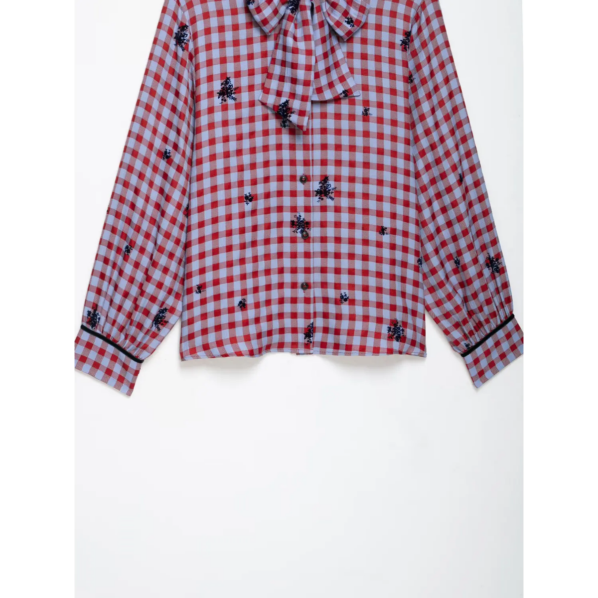 Front flat lay showing buttons and cuffs