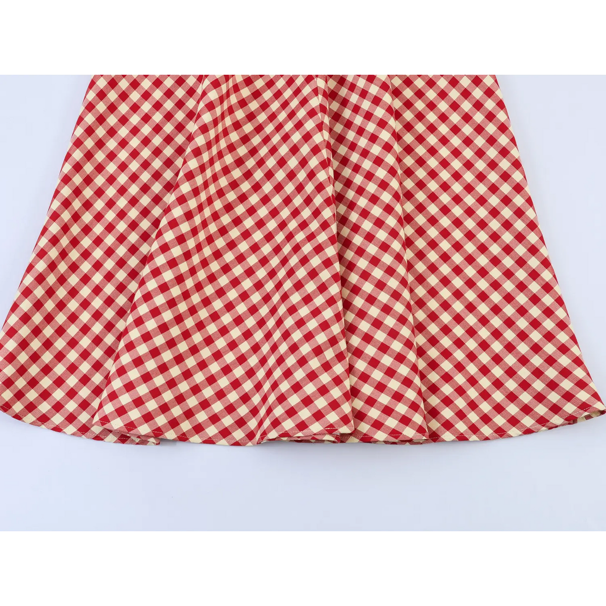 Close-up of flared skirt drape and pleat