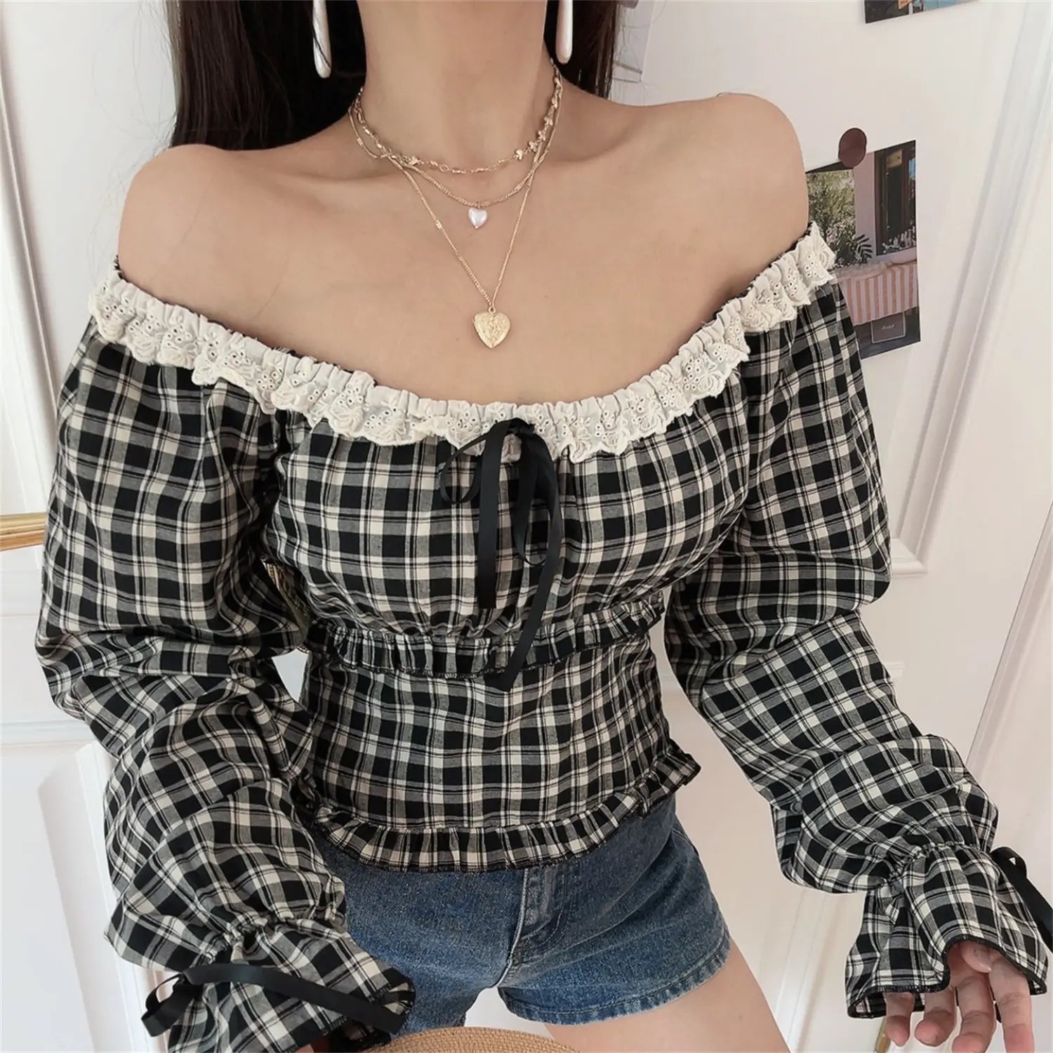 Gingham lace off shoulder crop top basic front model shot, wavy eyelet lace cold shoulder neck front black ribbon drawstring elastic smocked waist tie flare long sleeve vintage sweet girl slim cropped top basic lifestyle display