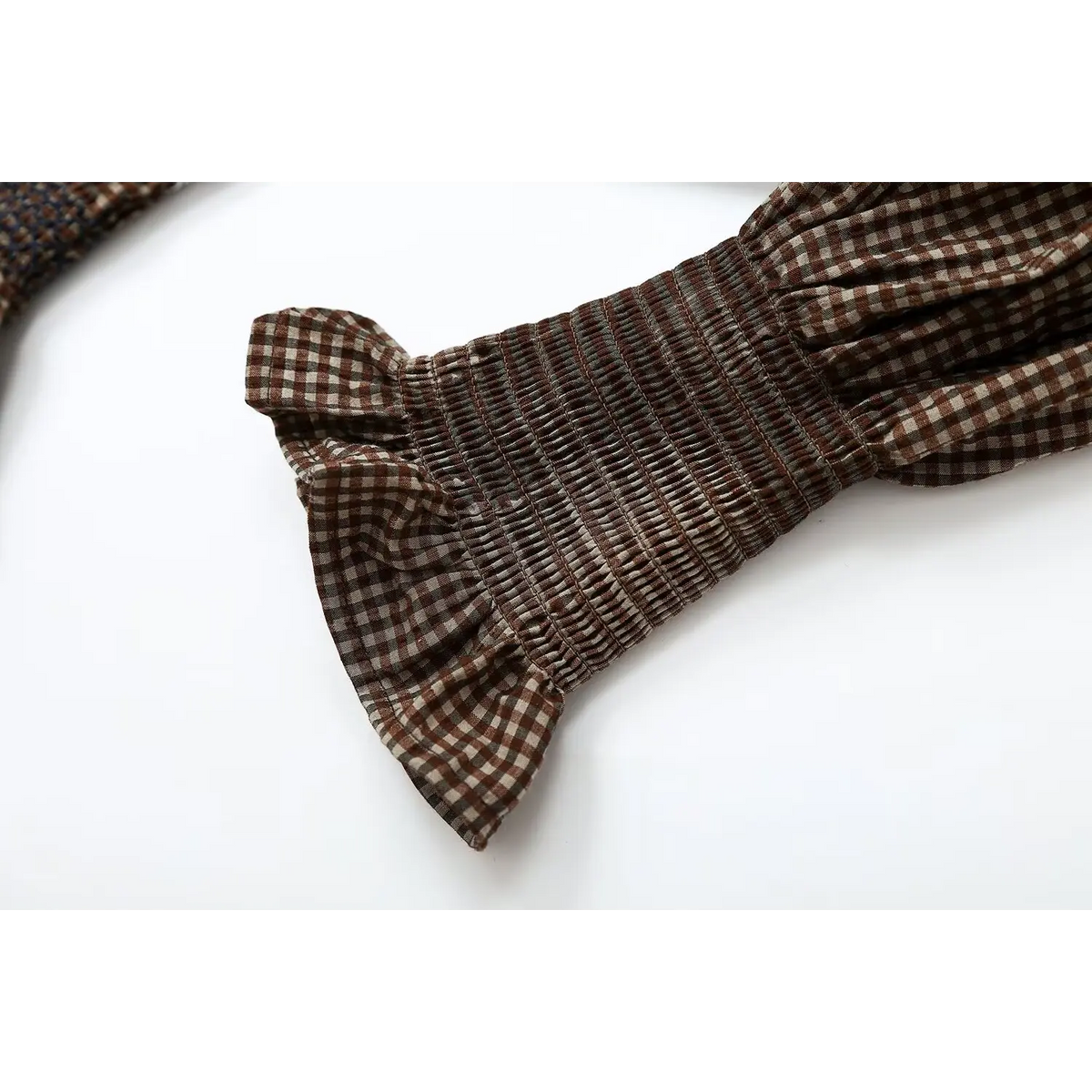 Close-up of smocked ruffle cuff