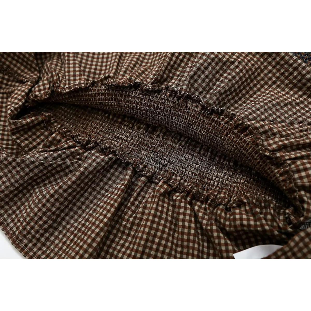 Close-up of inner smocked waistband finish