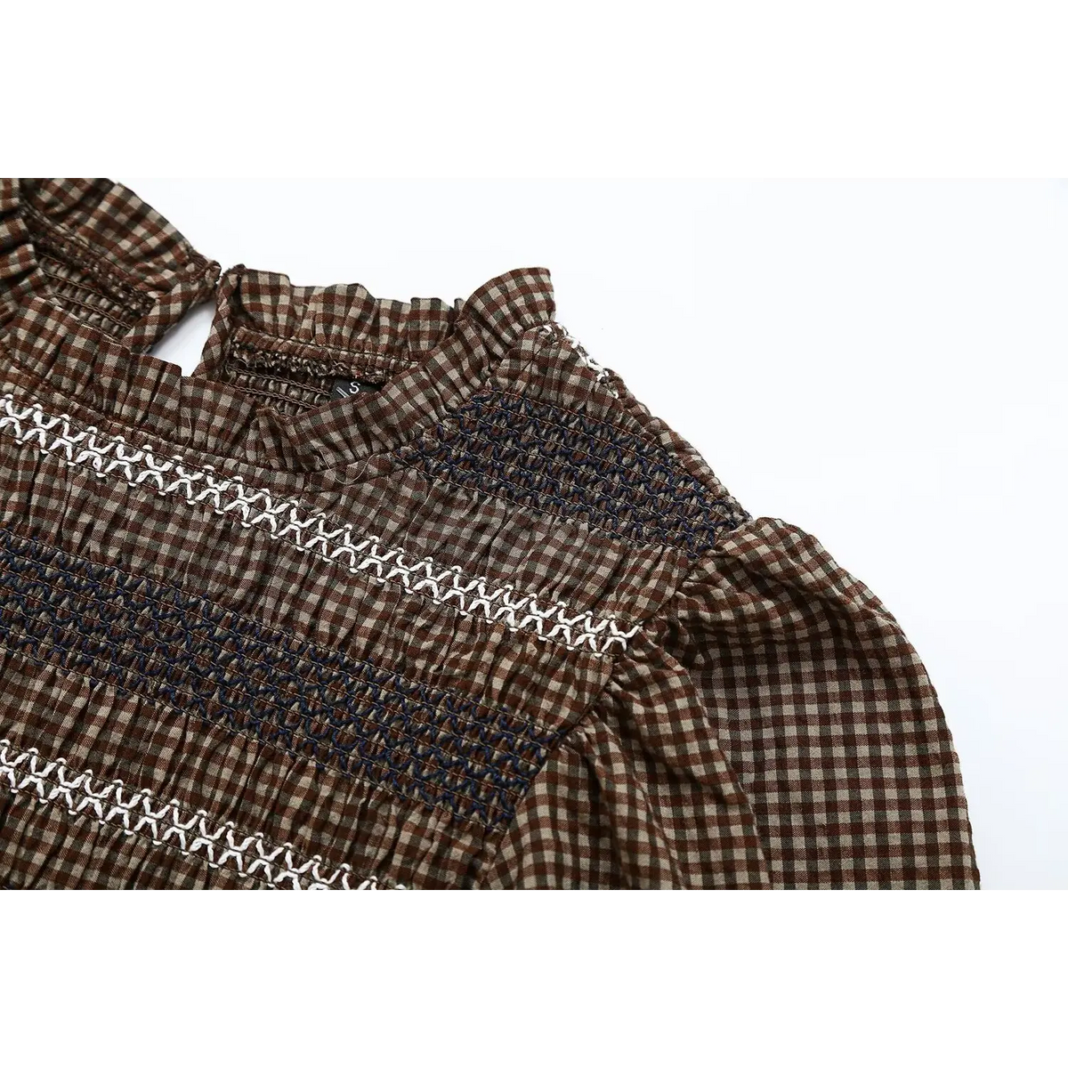 Close-up of puff shoulder and smocked yoke