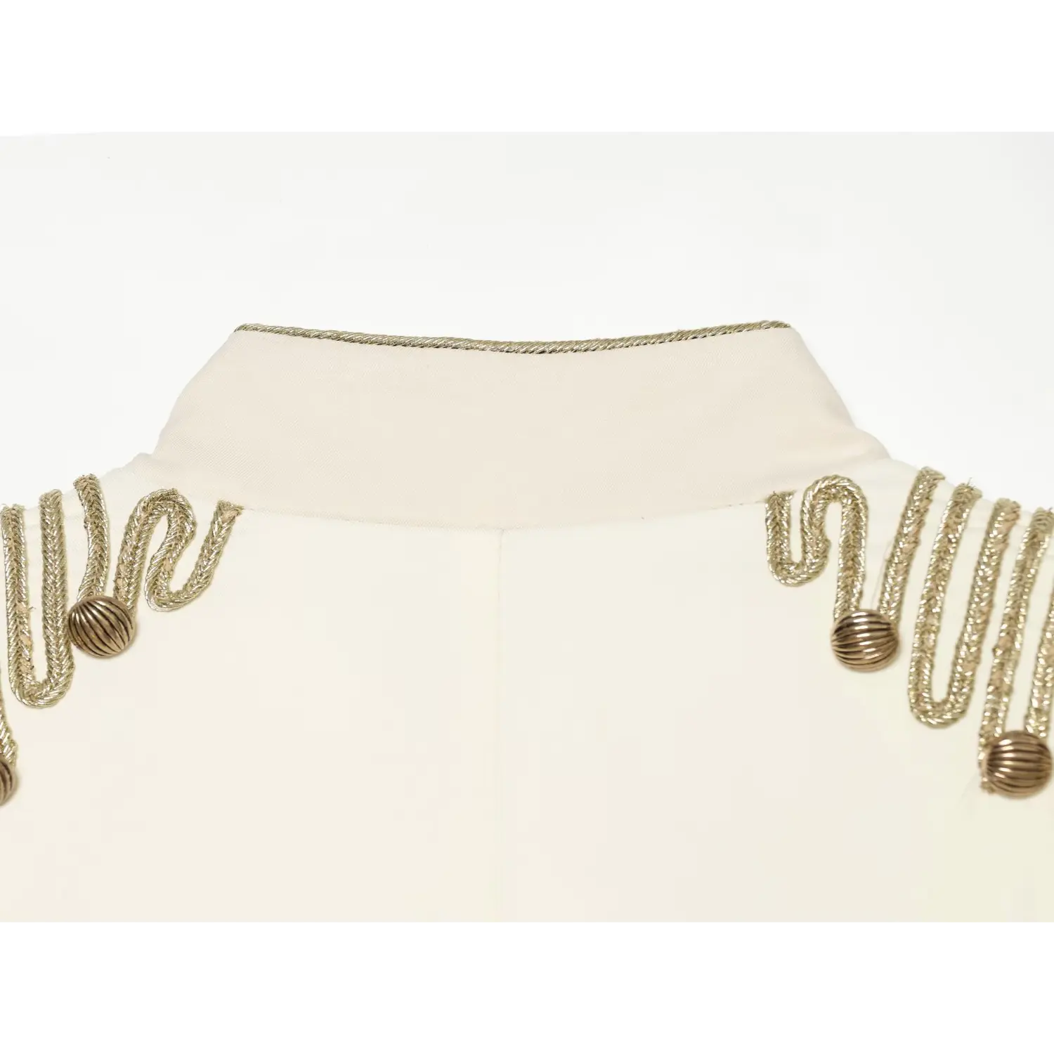 Shoulder epaulet detail, gold cord braiding and round metal buttons on cream cropped jacket