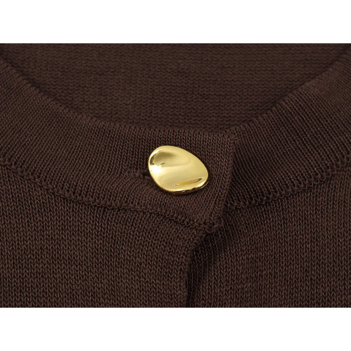 Close-up of gold metal button