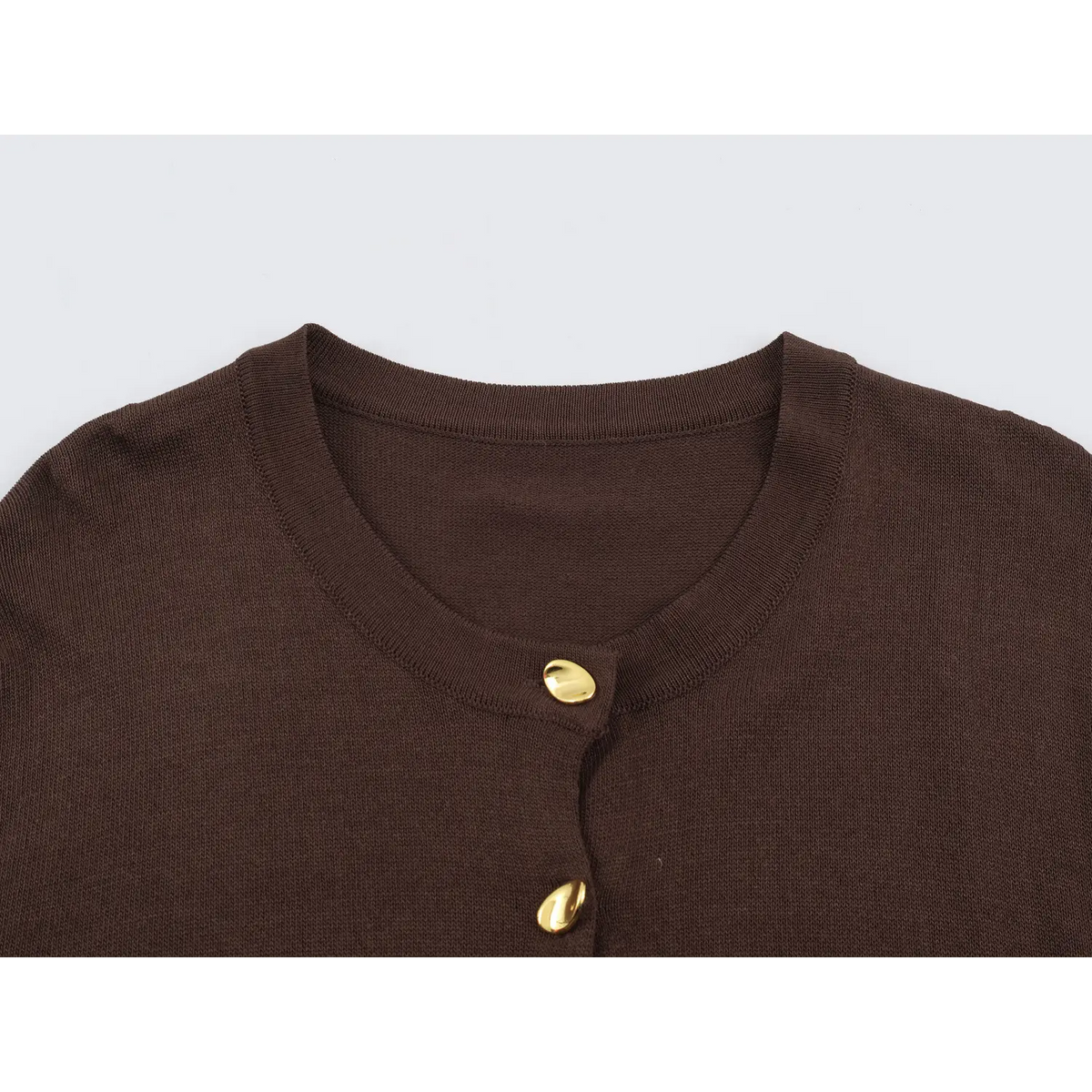 Close-up of brown round neck and buttons