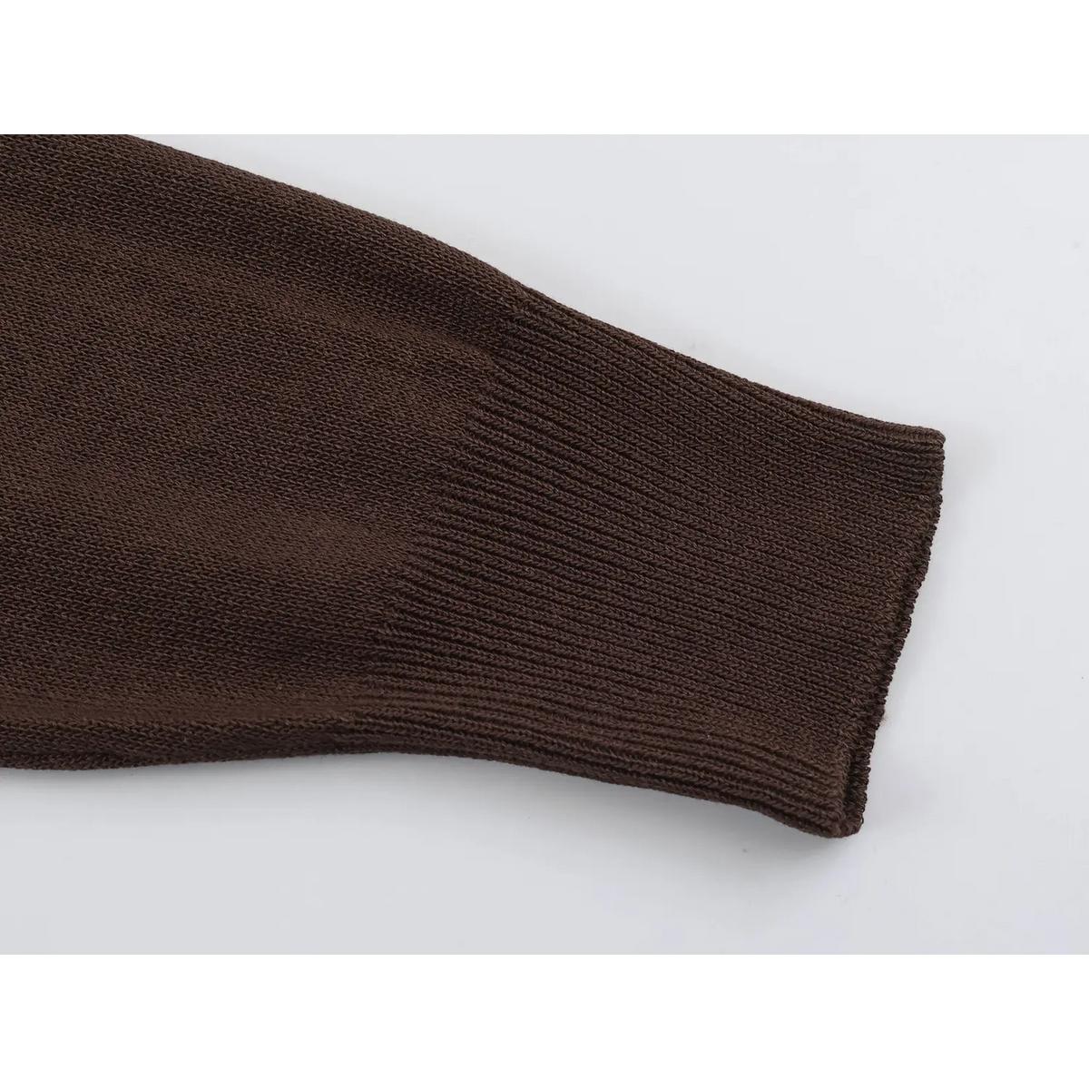 Close-up of brown ribbed cuff