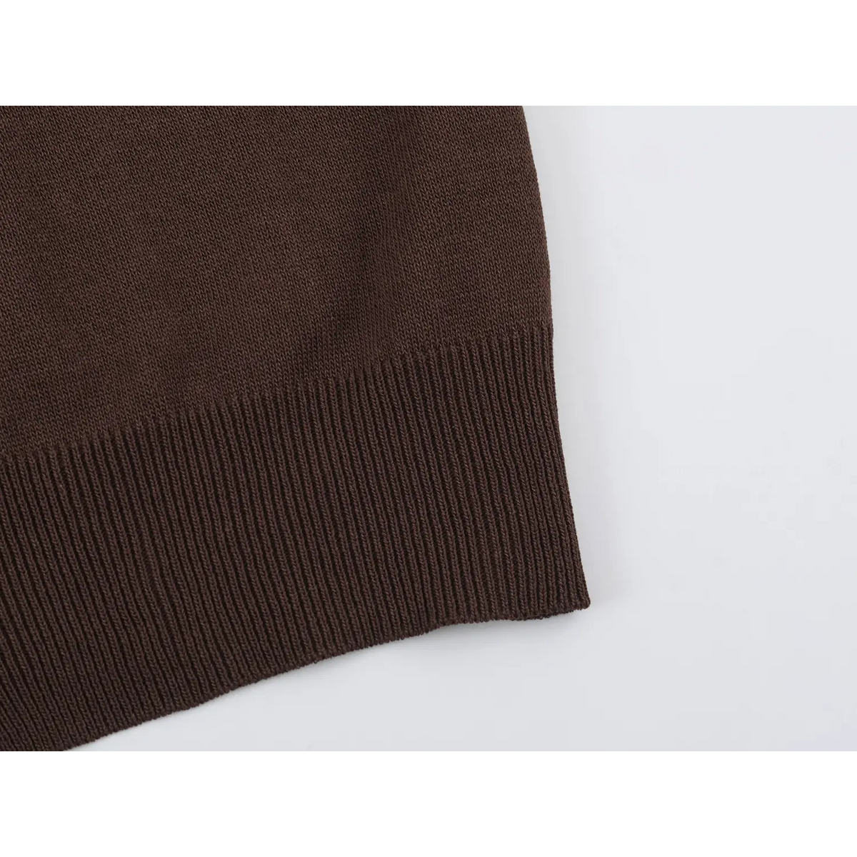 Close-up of brown ribbed hem
