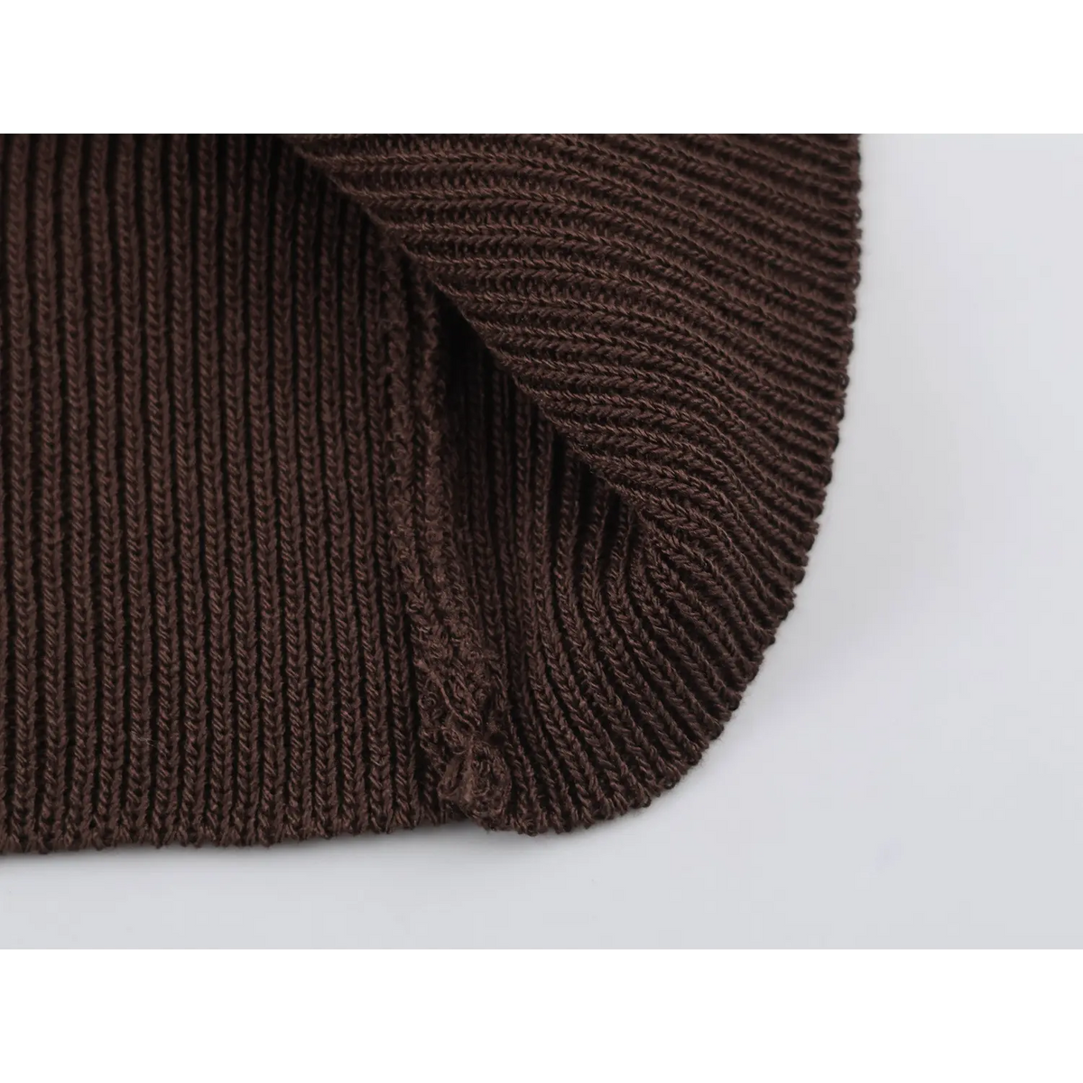 Close-up of brown ribbed hem detail