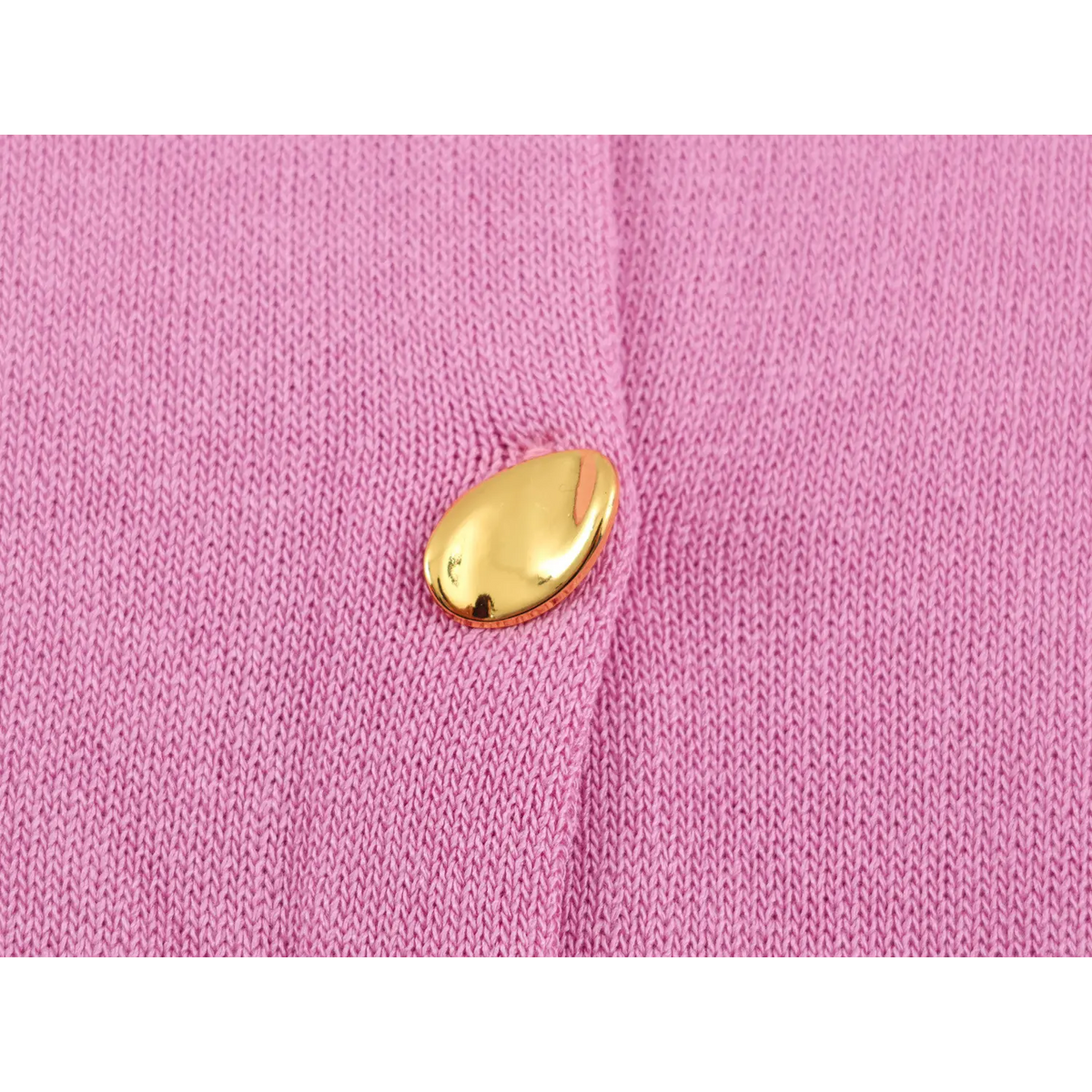 Close-up of pink gold metal button