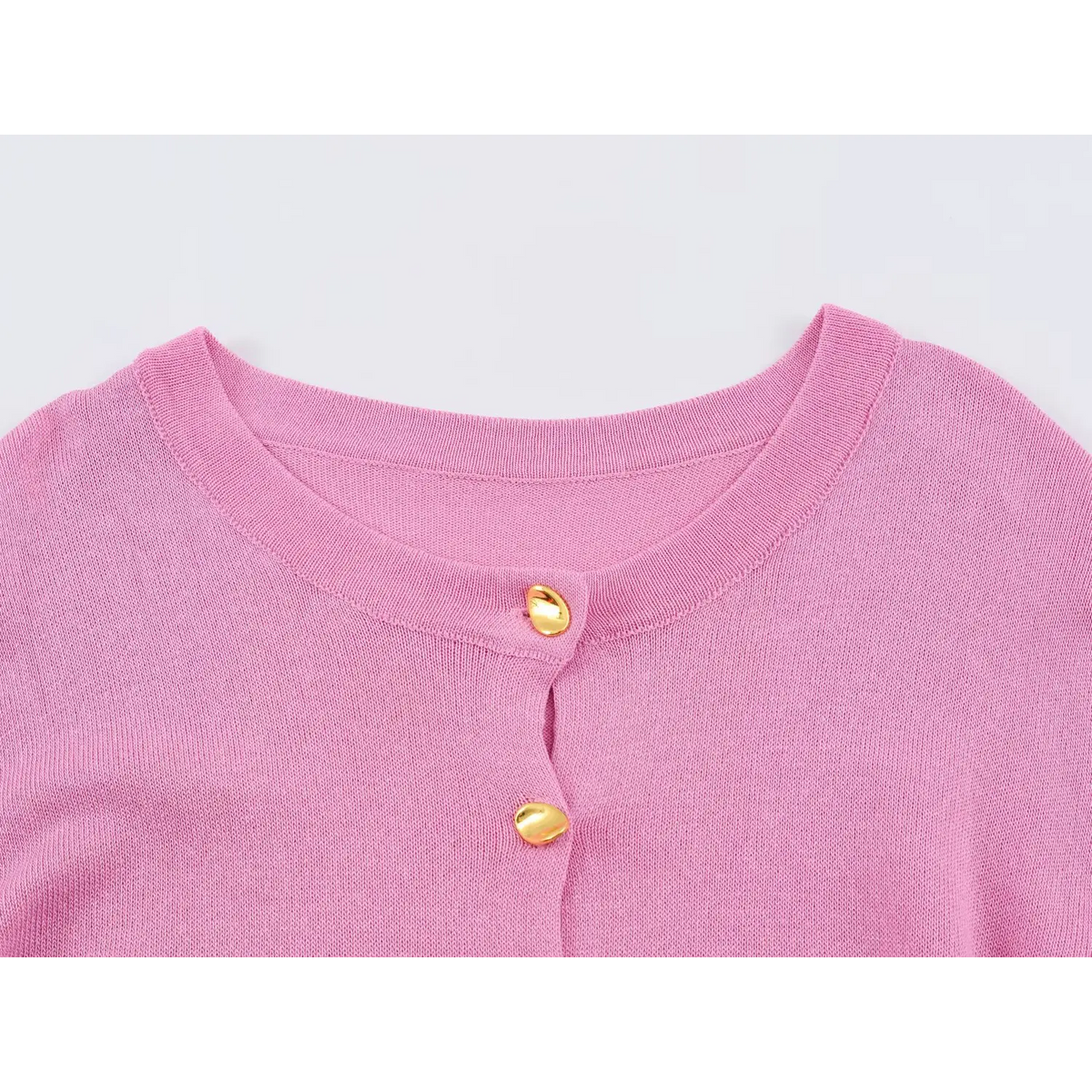 Close-up of pink round neck and buttons