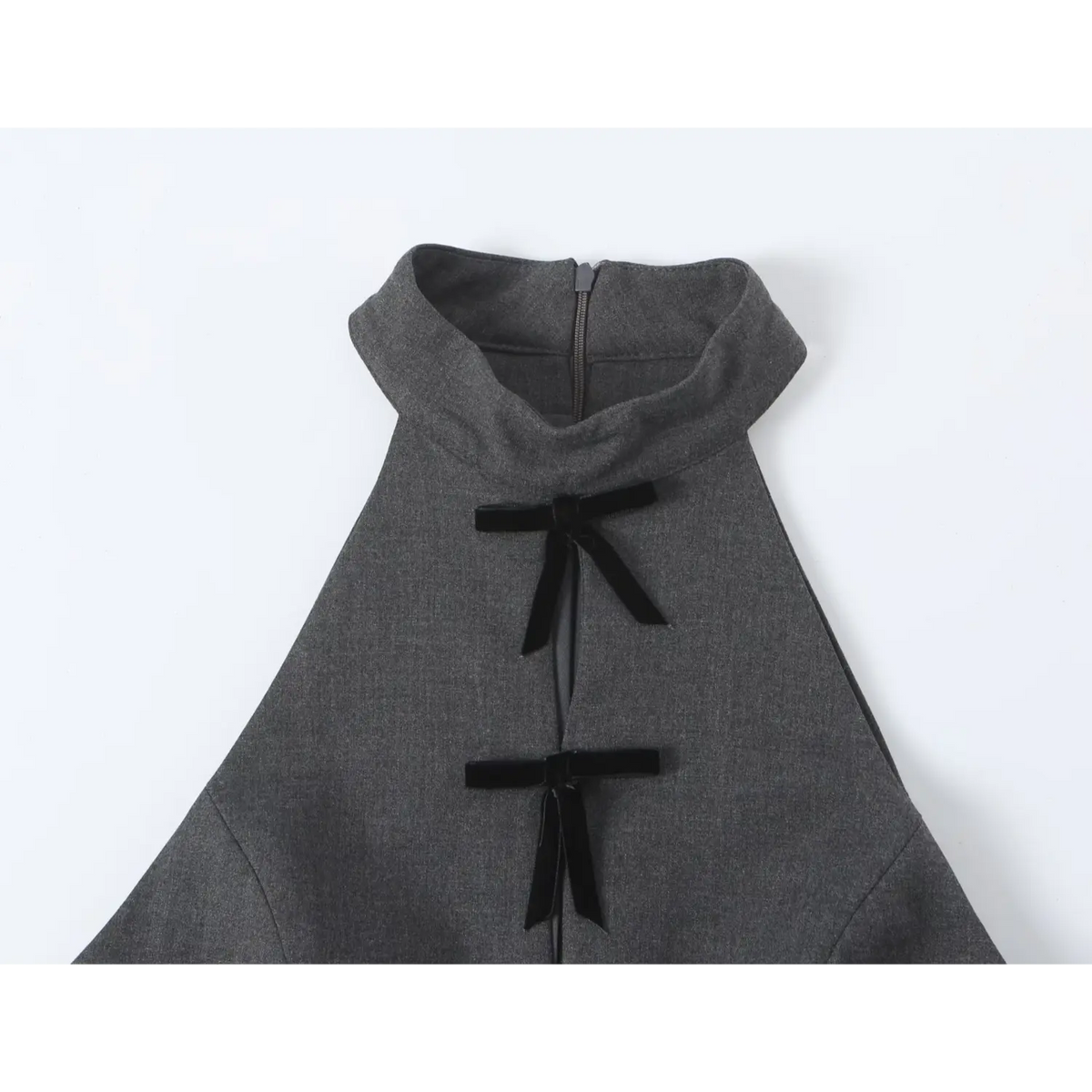 Close-up of halter stand collar, back zipper and velvet bow