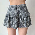 Gray and white plaid tiered ruffle mini skirt with a drawstring waist.