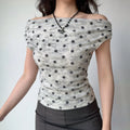 The complete outfit, featuring the polka dot top and gray midi skirt.